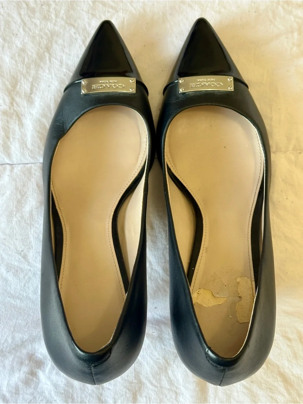 Coach Black Pointed-Toe Leather Flats with Logo Cap